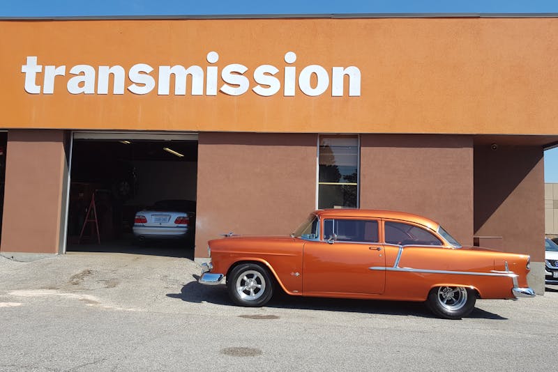 a car outside a transmission repair shop
